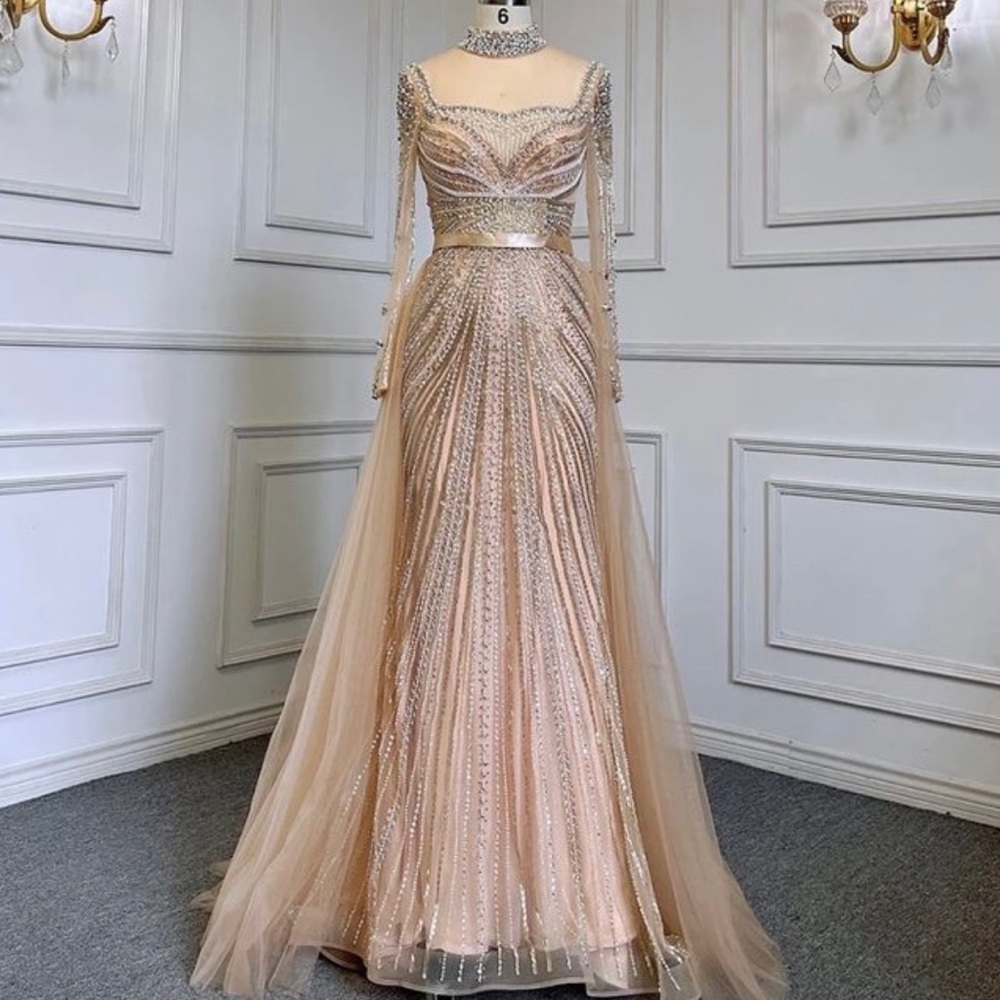 Beautiful gown brand new never worn with removal skirt